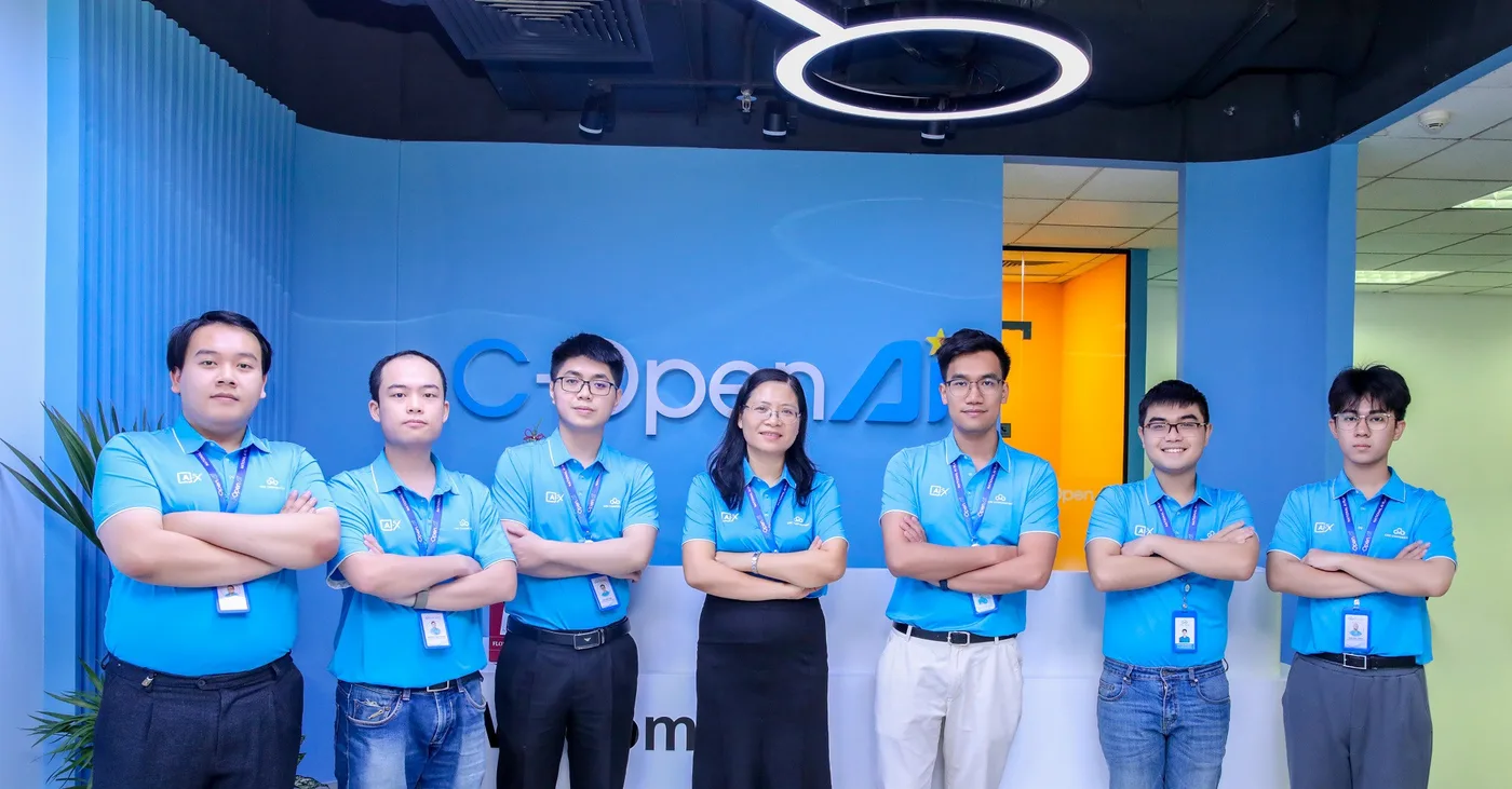 The CMC team in front of the wall of its AI lab
